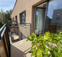 Balcony of a 2-room apartment on Sadova Street in Senica with a view of greenery.
