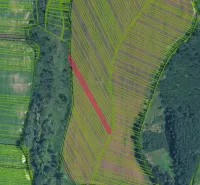 Aerial view of agricultural and forest lands in Žilina with marked parcels.