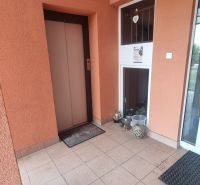 Entrance area with a lift and tiles in a 2-room apartment in Ivanka pri Nitre.