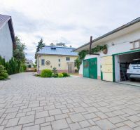 A family house on Topolianska Street in Michalovce with a garage and a paved courtyard.