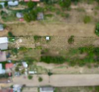 Aerial view of gardens and family houses on Topolianska Street in Michalovce.