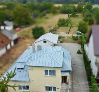 A family house on Topolianska Street in Michalovce with a landscaped yard and garden.