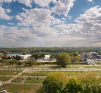 View of the surroundings from Znievska Street in Bratislava - Petržalka, greenery and roads.