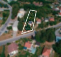 A family house on Nemečkovská Road in Prašice with a fenced garden.