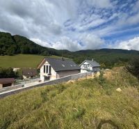 A house in a natural setting with hills in Považská Bystrica, a suitable location for living.
