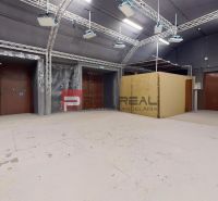 A large office space with lighting equipment and a wooden decor floor.