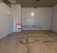 An empty warehouse space with a concrete floor and white walls in Warehouses and Halls.