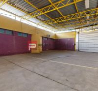 Warehouses and halls with concrete floors and yellow structures.