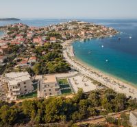 Aerial view of Sevid and a holiday apartment by the coast with a beautiful beach.