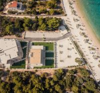Aerial view of a holiday apartment in Sevid near a beautiful beach and crystal-clear sea.