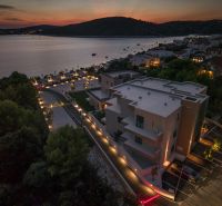 Exterior of a holiday apartment in Sevid, evening view of the lighting and the coastline.