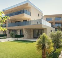 A recreational apartment in Sevid surrounded by greenery, stone facades, and a spacious terrace.