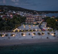 Night view of the Recreational Apartment in Sevid with illuminated beach and surrounding landscape.