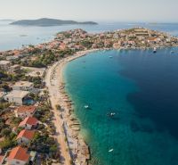 The coast of Sevid with recreational apartments and azure sea in a summer atmosphere.