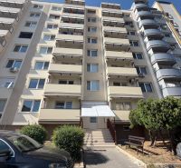 The exterior of the apartment building on Palkovičova Street in Topoľčany with parking in front of the 3-room apartment.