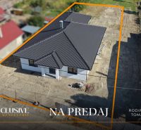 For sale: family house in Tomášikovo with dark roofing and a garden.
