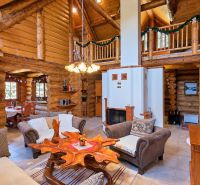 Wooden interior with a fireplace and stylish furniture in a cabin with a wooden decor floor.
