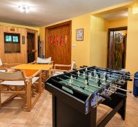 Recreational room in a cottage with a Finnish sauna and table football.