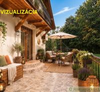 Outdoor terrace of the cottage in Ružiná with comfortable seating and decorative plants.