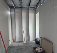 Unfinished interior of a family house with a toolbox and metal frames.