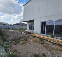Construction of a family house on Lichnerova Street in Senec with a pile of soil.