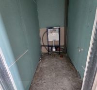 A toilet in a family house prepared for the installation of sanitary equipment.
