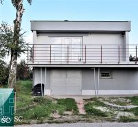 Cottage at the SUNNY LAKES SOUTH in Senec with a green lawn and an outdoor staircase.
