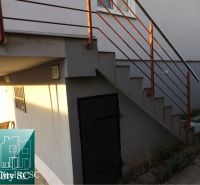 Exterior of a family house at Sunny Lakes South in Senec with a staircase and railing.