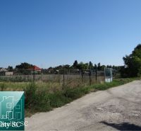 A plot of land surrounded by a fence on Vrbová Street in Jelka suitable for living.