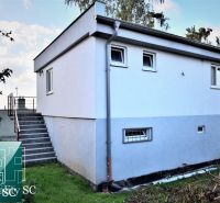 A house with a white facade and an external staircase at SUNNY LAKES SOUTH, Senec.