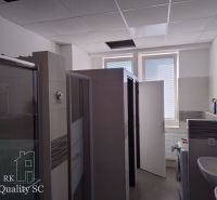 Bathroom in the building Warehouses and halls with a sink, toilets, and cleaning supplies.