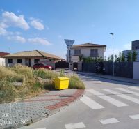 Exterior in Senec for Land - housing, showing a street with family houses.