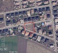 Aerial photograph of residential plots in Senec showing streets and buildings.