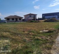 A residential building plot in Senec, surrounded by family houses.