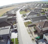 Aerial view of a residential district and surrounding housing plots in Senec.