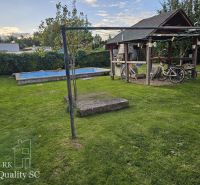 A family house in Tureň with a landscaped garden, gazebo, and swimming pool on Tureň Street.