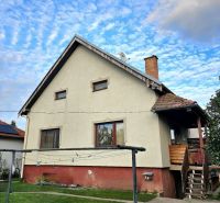 Family house in Tureň on Tureň street with a lawn and a clothesline.