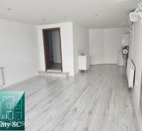 Interior with wood-patterned flooring and air conditioning in commercial premises.