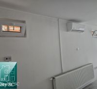 Commercial premises with white walls, air conditioning, and a radiator.