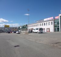 Commercial premises on Strojnícka Street in Prešov with parking and retail units.