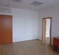 Commercial premises with white walls, wood-patterned flooring, and air conditioning.