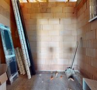 Interior construction with brick walls in a family house, material ready for installation.
