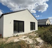A family house on Karasova Street in Senec with a garden and a clear sky.