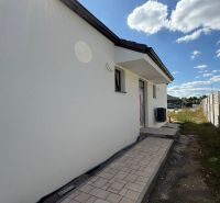 A family house on Karasova Street in Senec with a sidewalk and a garden.
