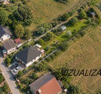 Aerial view of family houses in Mikušovce surrounded by greenery and gardens.