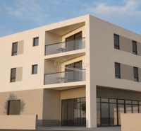 The exterior of a holiday apartment in the town of Vodice with a modern facade and balconies.