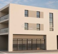 A recreational apartment in the city of Vodice with wide windows and a balcony with glass railings.