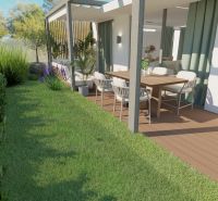 A garden with a terrace and seating area in a 4-room apartment with a wooden decor floor.