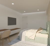 A bedroom in a 4-room apartment with a TV, a desk, and a bed.