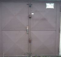 Brown metal garage doors on Čmelíkova Street in Bratislava - Ružinov.